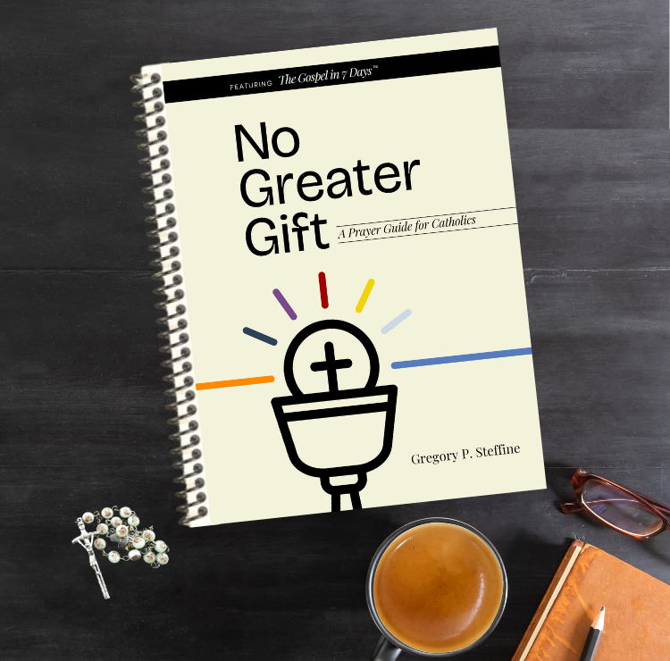 Book titled 'No Greater Gift' on a dark surface with a cup of coffee and glasses.